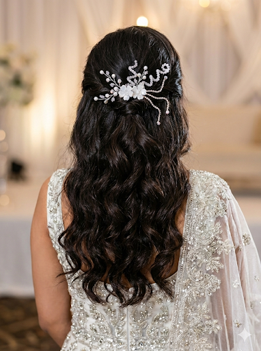 Intricate wire-wrapped floral branches with elegant cascading crystal chains